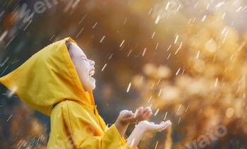 child under autumn rain