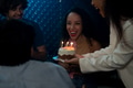 Woman giving birthday cake to friend in party at home - PhotoDune Item for Sale