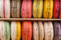 Stack of colorful macaroons stacked up in the box for background - PhotoDune Item for Sale