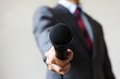 Man in business suit holding a microphone - PhotoDune Item for Sale