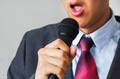 Man in business suit holding a microphone - PhotoDune Item for Sale