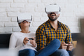 Young Couple Playing With Virtual Reality - PhotoDune Item for Sale