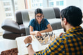 Young Couple Playing Chess Game at Home - PhotoDune Item for Sale