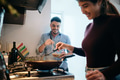 Young Couple Cooking Together And Having Fun - PhotoDune Item for Sale