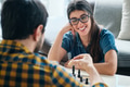 Young Woman Playing Chess Game With Boyfriend - PhotoDune Item for Sale