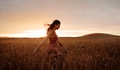 Carefree female strolling in the wheat field - PhotoDune Item for Sale