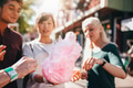 Three young people sharing cotton candyfloss - PhotoDune Item for Sale