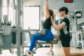 sport woman exercise chest muscle with lat pull down in gym with personal trainer male take care - PhotoDune Item for Sale