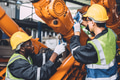 Engineer working service maintenance robot arm welding in assembly line automation factory industry. - PhotoDune Item for Sale