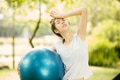 sport woman exercise outdoor feel sick headache over heat from hot weather summer season - PhotoDune Item for Sale