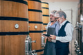 Winemaker working in modern large winery factory liquor drink industry quality and fermentation - PhotoDune Item for Sale