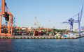 Crane lifting shipping containers at the seaport - PhotoDune Item for Sale