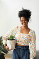 Woman holding houseplant in paper bag - PhotoDune Item for Sale