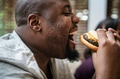 Man eating a big hamburger - PhotoDune Item for Sale