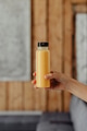 Woman holding a bottle of orange juice - PhotoDune Item for Sale