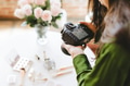 Female photographer shooting beauty products, white tone - PhotoDune Item for Sale
