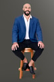 Cheerful businessman sitting on a wooden stool jobs and career campaign - PhotoDune Item for Sale