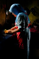 Malaysian lady using natural sunlight to prepare food in the kitchen - PhotoDune Item for Sale