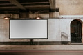 Blank billboard on a white wall - PhotoDune Item for Sale