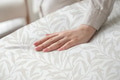 Hand on a soft duvet - PhotoDune Item for Sale