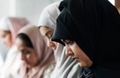 Muslim women praying in Tashahhud posture - PhotoDune Item for Sale