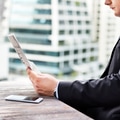 Businessman reading the financial news - PhotoDune Item for Sale