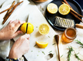 Aerial view of hands with knife cutting lemon - PhotoDune Item for Sale
