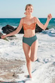 Happy woman in bikini at the beach on her vacation full body portrait - PhotoDune Item for Sale