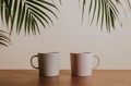 Earth tone color ceramic coffee cups on wooden table - PhotoDune Item for Sale