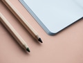 Blank notebook and pencil isolated on background - PhotoDune Item for Sale