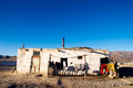 Old weathered house with mountain range in the background - PhotoDune Item for Sale