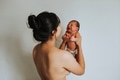 Mother holding her infant baby - PhotoDune Item for Sale