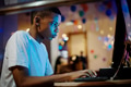 African american boy using a computer at night - PhotoDune Item for Sale