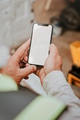 Man holding blank smartphone near a construction site - PhotoDune Item for Sale