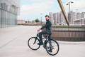 Elegant bearded young stylish businessman going to work by bike - PhotoDune Item for Sale
