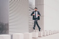 Energetic young bearded professional businessman jumping in mid-air - PhotoDune Item for Sale
