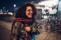 curly brunette girl smiling in the street - PhotoDune Item for Sale