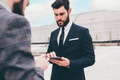 Two young contemporary businessman outdoors sharing and using tablet - PhotoDune Item for Sale