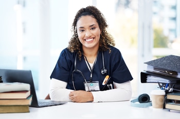 Nurse, portrait or laptop with medical student books, research education studying or hospital learn