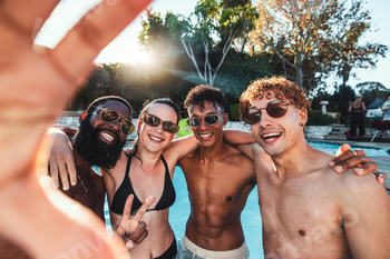 Peace sign, friends selfie and pool party, having fun or partying on new year. Swimming celebration
