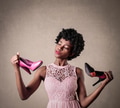 Girl choosing between two pairs of shoes - PhotoDune Item for Sale