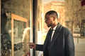 Man looking at a shop window - PhotoDune Item for Sale