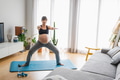 Pregnant woman doing exercises at home - PhotoDune Item for Sale