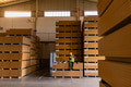 Worker with Down syndrome having break in factory, warehouse, drinking coffee from thermos. Concept - PhotoDune Item for Sale