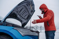 Angry man standing by electric car, battery run out of power before reaching destination. Man phone - PhotoDune Item for Sale