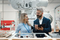 Female engineer and male production manager standing in modern industrial factory, talking about - PhotoDune Item for Sale
