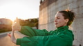Young woman in sportive clothes doing stretching. - PhotoDune Item for Sale