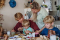 Family eating breakfast together in home kitchen. Healthy breakfast or snack before kindergarden - PhotoDune Item for Sale