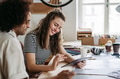Young colleagues working together in startup company. - PhotoDune Item for Sale