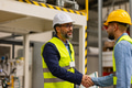 Engineer shaking hands with project manager in modern industrial factory, talking about new - PhotoDune Item for Sale